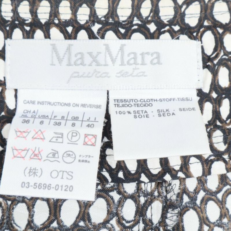 MaxMara etikett med materialinformation 100% silke